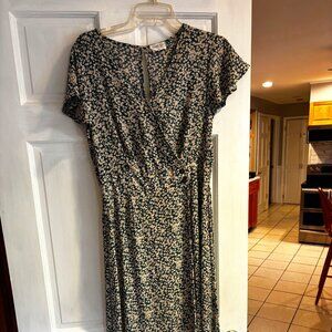 Sienna Sky feminine, retro dress, midi length, white flowers on green background